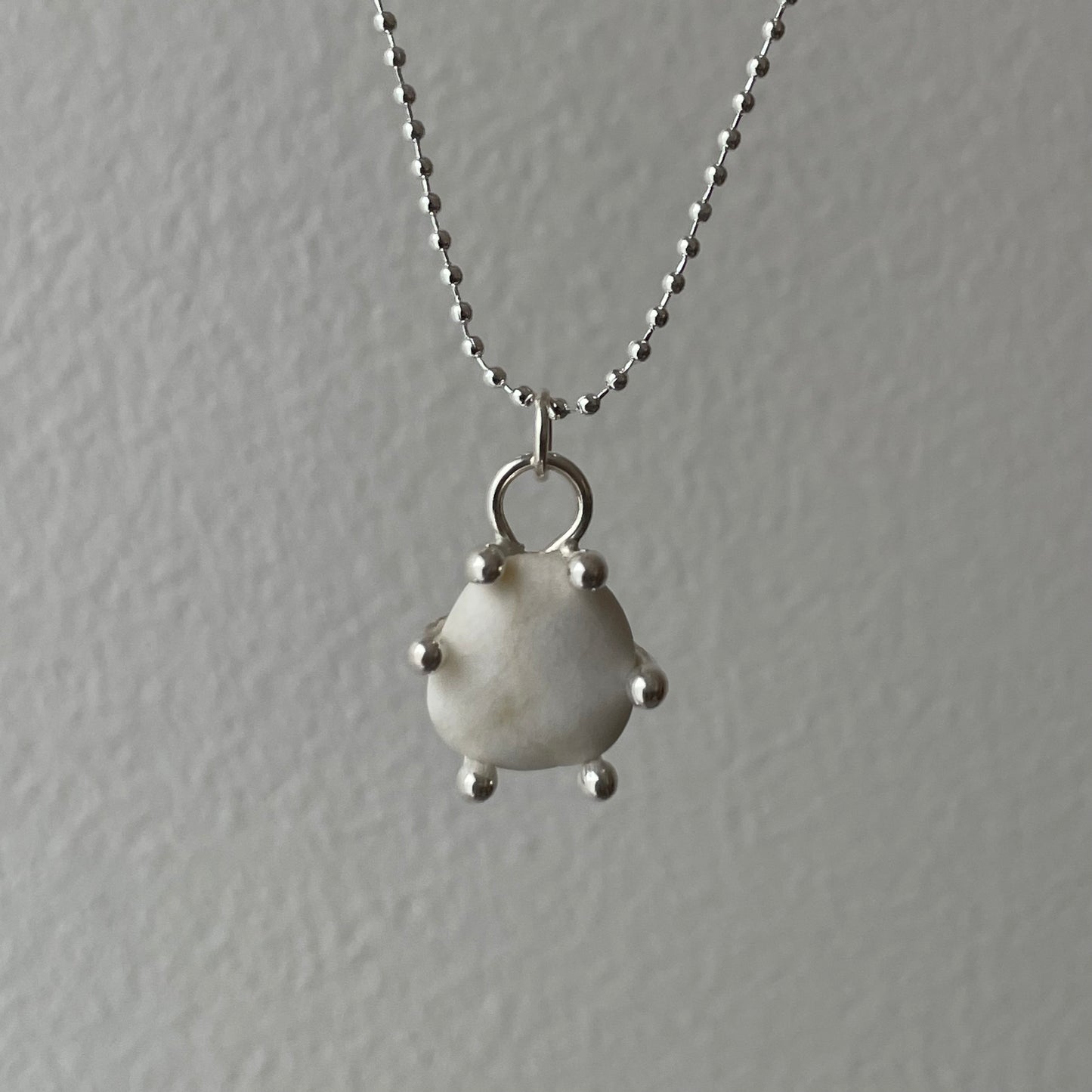 white pebble pendant