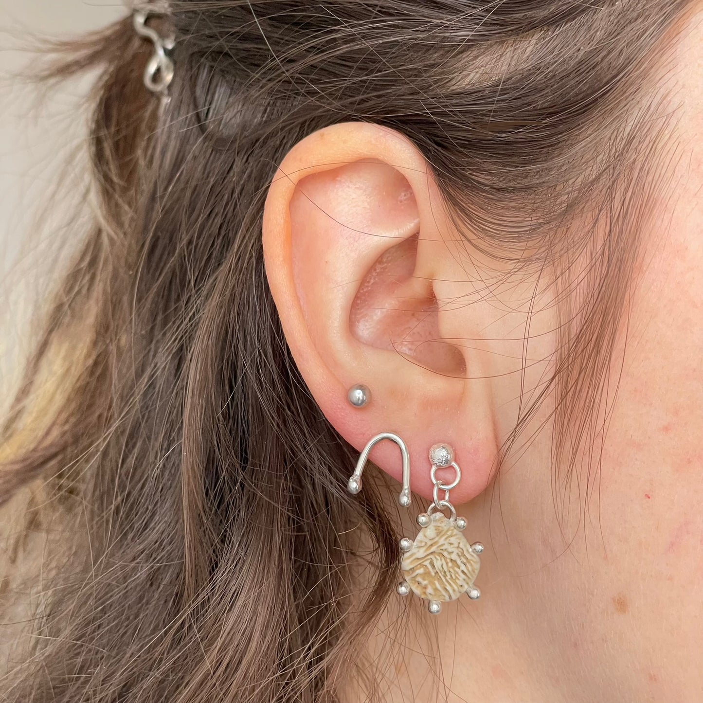 shell dangle studs