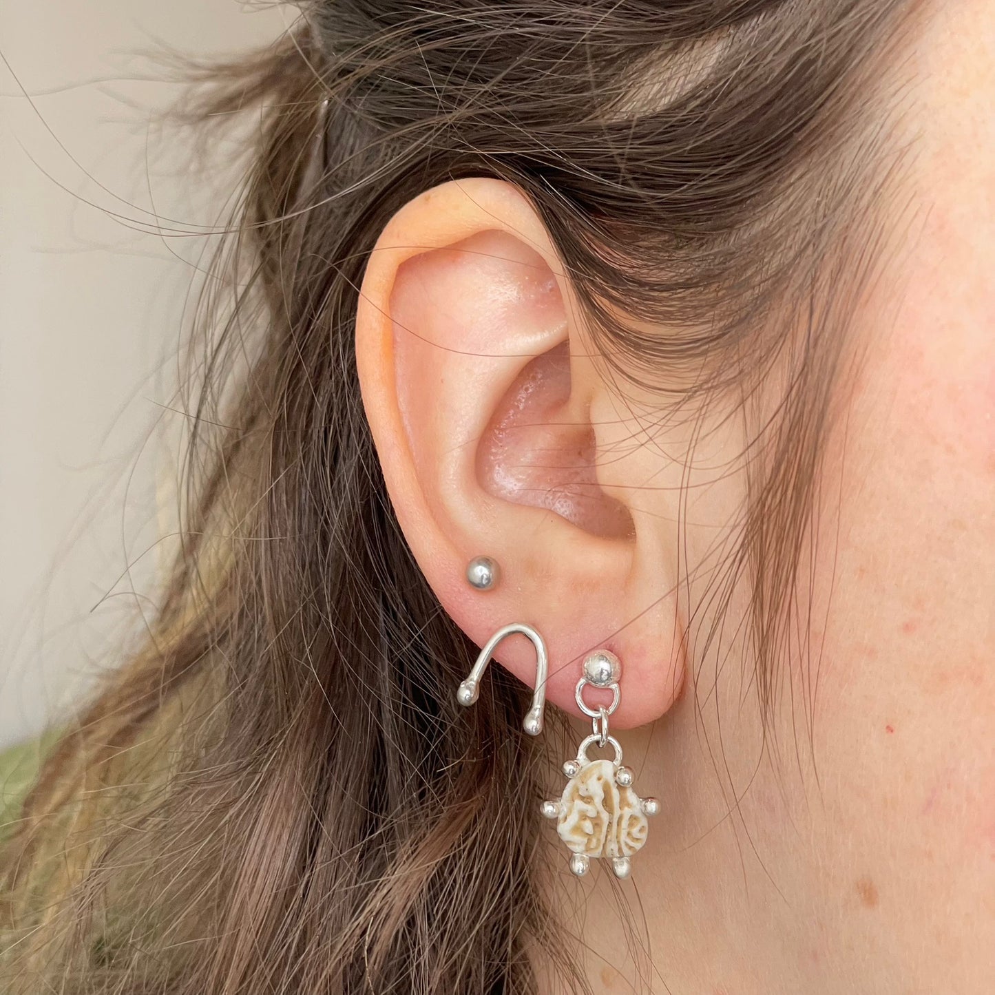 shell dangle studs